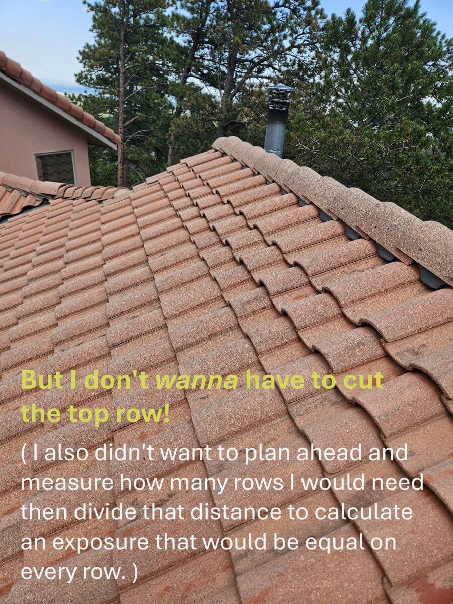 A concrete tile roof with an improperly measured and installed top row.